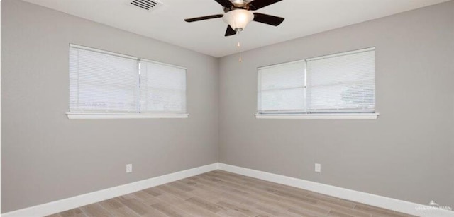 empty room featuring ceiling fan and light hardwood / wood-style floors