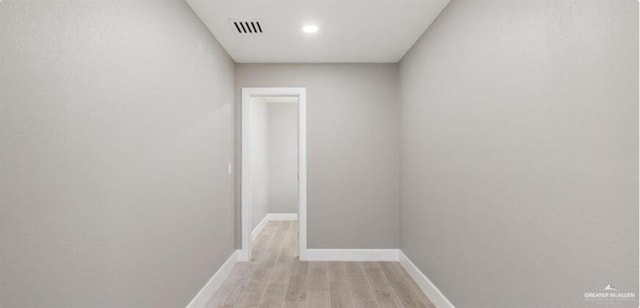 hall with light hardwood / wood-style floors