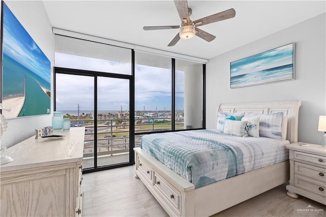 1000 Padre Blvd, South Padre Island, TX 78597 - bedroom featuring expansive windows and ceiling fan