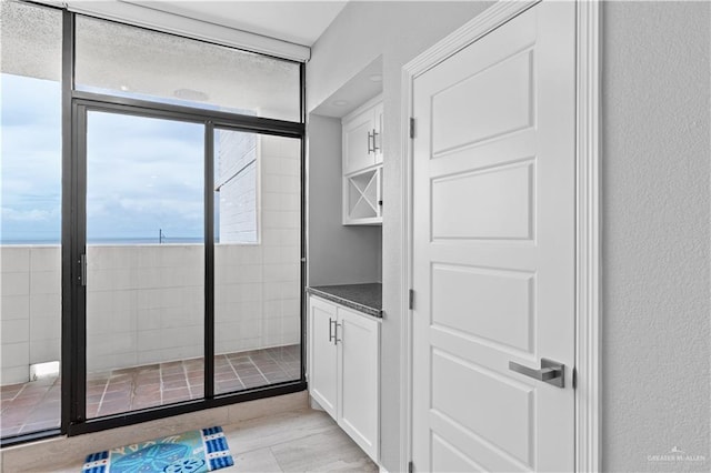 1000 Padre Blvd, South Padre Island, TX 78597 - bathroom featuring a textured wall, vanity, and a shower