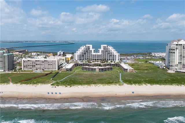 bird's eye view featuring a water view and a view of the beach