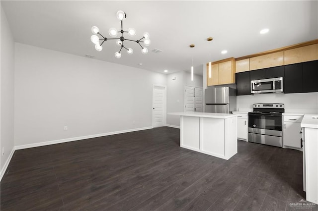 kitchen featuring pendant lighting, an inviting chandelier, stainless steel appliances, a kitchen island, and dark hardwood / wood-style flooring