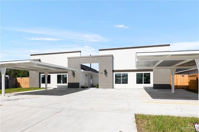 back of property featuring a carport