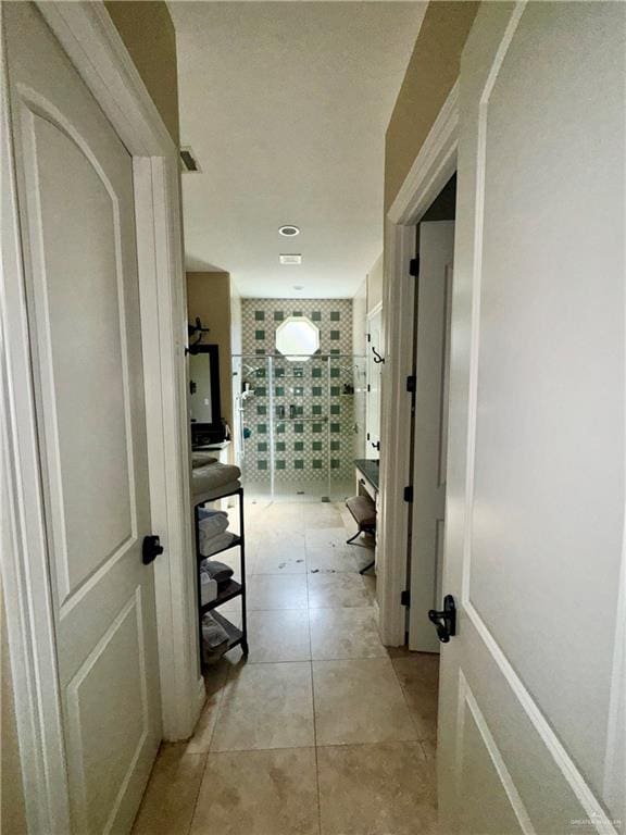 corridor featuring light tile patterned floors