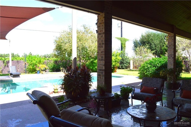 view of patio / terrace featuring a fenced in pool