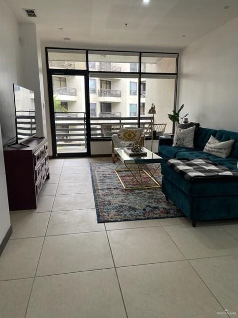 813 Travis St Unit 205, Mission, TX 78572 - living area featuring tile patterned floors and a wall of windows