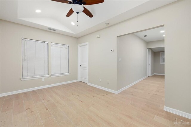 820 Beech Ave Unit 1, Mcallen, TX 78501 - empty room featuring light wood-style floors, a ceiling fan, recessed lighting, baseboards, and a raised ceiling