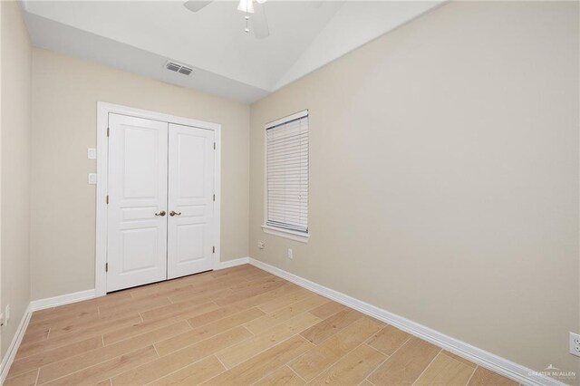 820 Beech Ave Unit 1, Mcallen, TX 78501 - unfurnished bedroom with light wood-type flooring, baseboards, vaulted ceiling, ceiling fan, and a closet