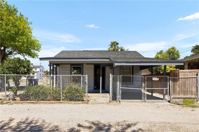 820 Beech Ave Unit 1, Mcallen, TX 78501 - view of front of home with a gate, fence, roof with shingles, and covered porch