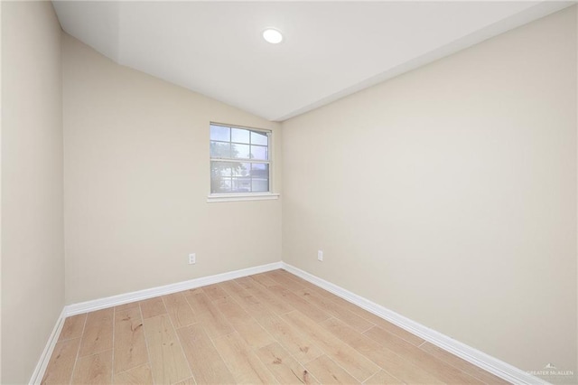 820 Beech Ave Unit 1, Mcallen, TX 78501 - empty room with baseboards, vaulted ceiling, recessed lighting, and light wood finished floors