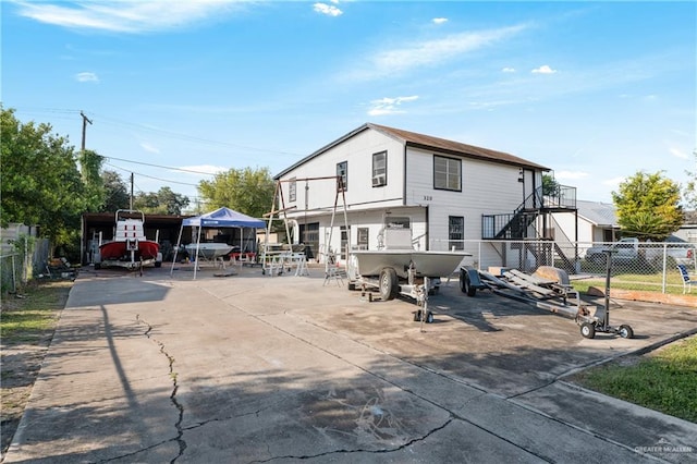 rear view of property featuring a carport