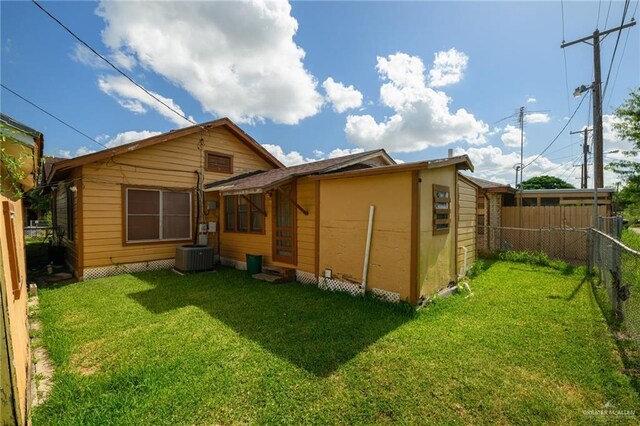 912 W Pierce Ave, Harlingen, TX 78550 - rear view of house with central AC unit