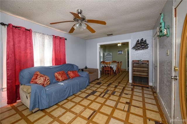 912 W Pierce Ave, Harlingen, TX 78550 - living area with light flooring, a ceiling fan, and a textured ceiling