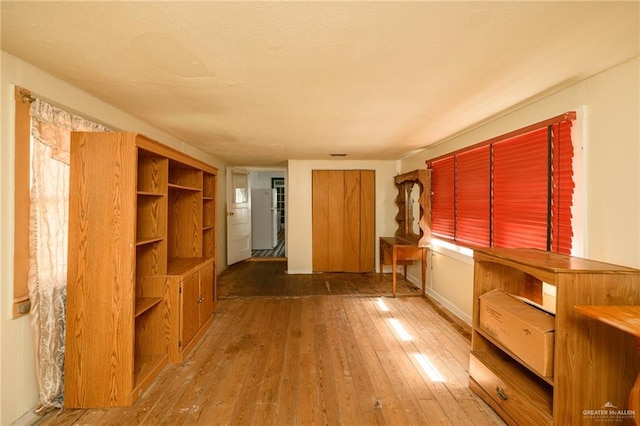 912 W Pierce Ave, Harlingen, TX 78550 - unfurnished bedroom featuring hardwood / wood-style floors and baseboards