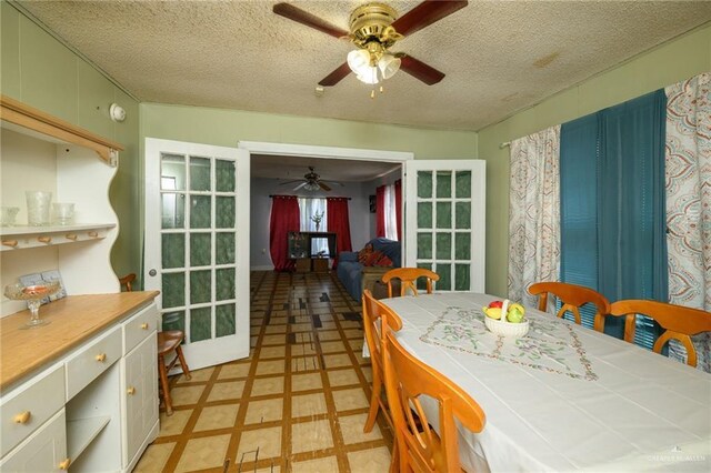 912 W Pierce Ave, Harlingen, TX 78550 - dining space with a ceiling fan, a textured ceiling, and light floors