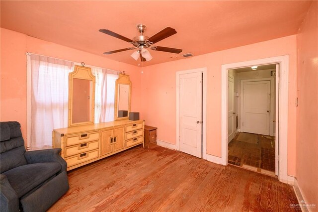 912 W Pierce Ave, Harlingen, TX 78550 - sitting room featuring a ceiling fan, light wood-style flooring, and baseboards