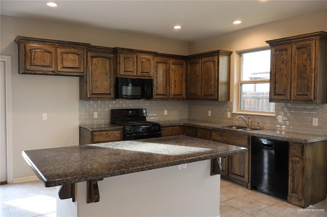 5712 River Rd, Mcallen, TX 78504 - kitchen with black appliances, a center island, light tile patterned floors, tasteful backsplash, and recessed lighting