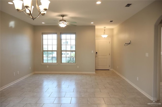 5712 River Rd, Mcallen, TX 78504 - empty room featuring a ceiling fan, arched walkways, recessed lighting, and a chandelier