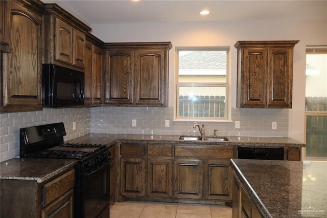 5712 River Rd, Mcallen, TX 78504 - kitchen featuring black appliances, dark stone countertops, healthy amount of natural light, decorative backsplash, and recessed lighting