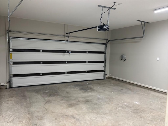 5712 River Rd, Mcallen, TX 78504 - garage featuring a garage door opener and baseboards