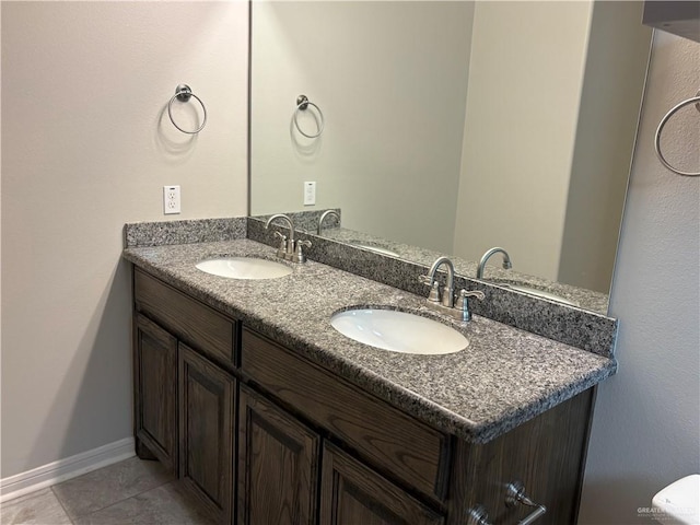 5712 River Rd, Mcallen, TX 78504 - bathroom featuring double vanity and tile patterned floors