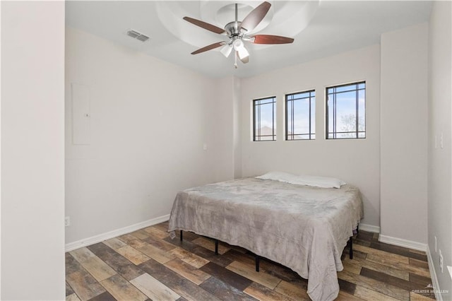 bedroom with hardwood / wood-style flooring and ceiling fan