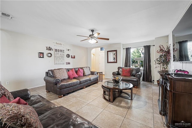 living room with light tile patterned flooring and ceiling fan