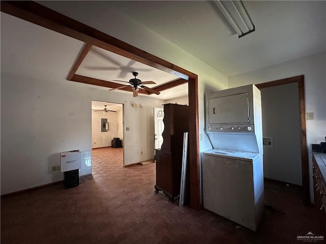 interior space featuring stacked washing maching and dryer and dark parquet floors