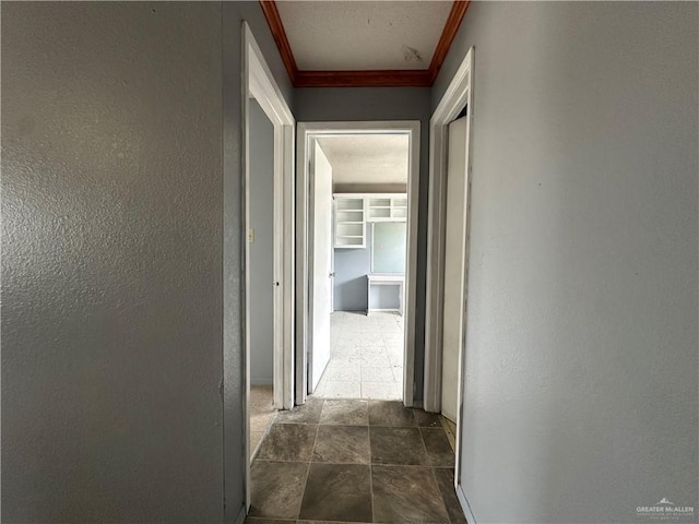 corridor featuring crown molding