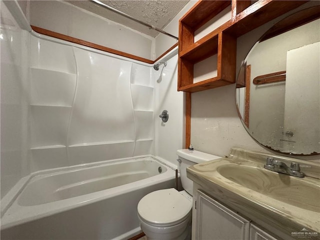 full bathroom with vanity, a textured ceiling, toilet, and washtub / shower combination