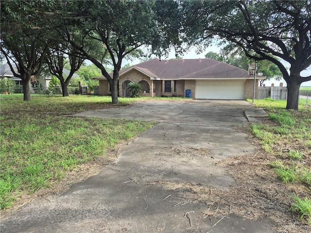 4401 W Monte Cristo Rd, Edinburg, TX 78541 - single story home featuring a garage, concrete driveway, and brick siding