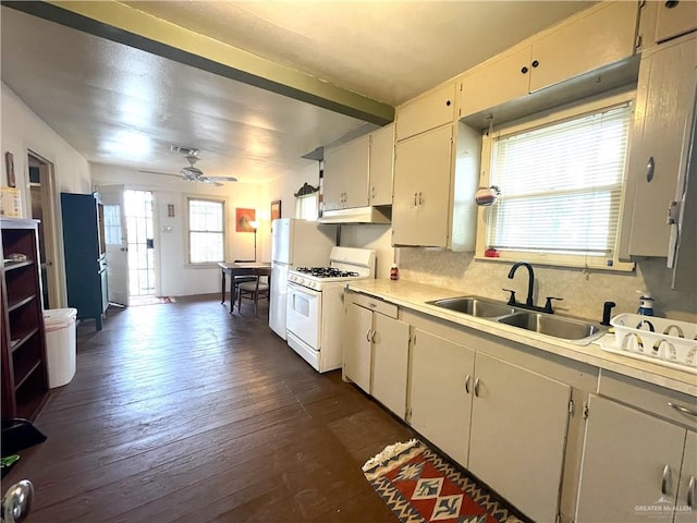 207 W Clark Ave, Pharr, TX 78577 - kitchen with under cabinet range hood, light countertops, white range with gas cooktop, a sink, and a ceiling fan