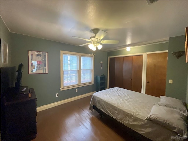 207 W Clark Ave, Pharr, TX 78577 - bedroom with wood finished floors, ceiling fan, two closets, and baseboards