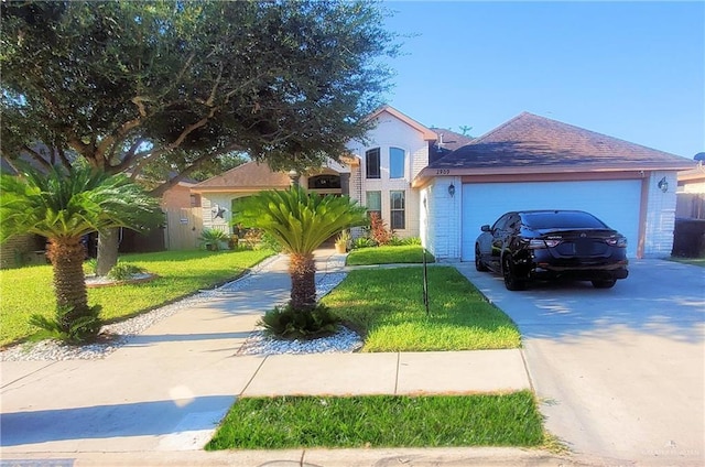 view of front of home with a front yard and a garage