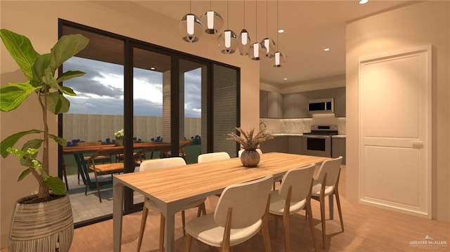 dining area featuring light wood-type flooring