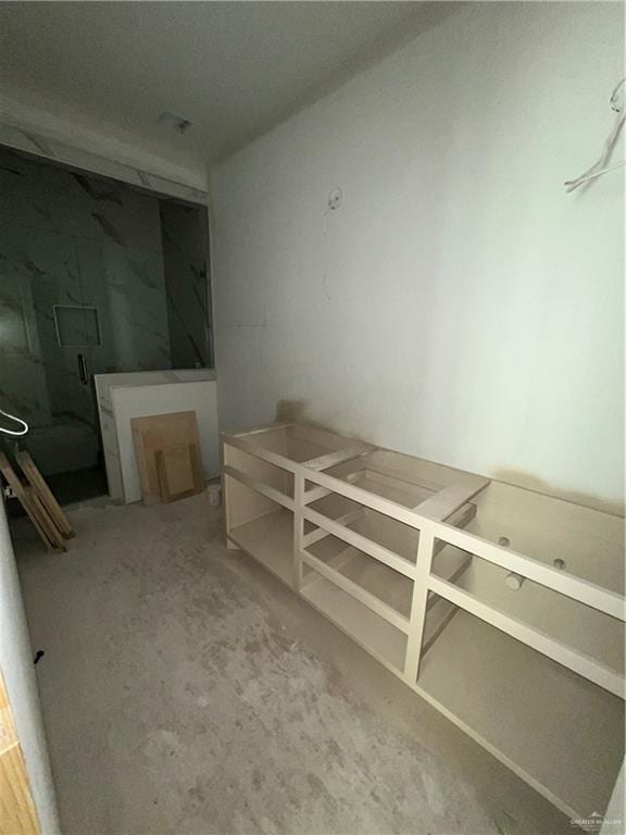 unfurnished bedroom featuring concrete floors