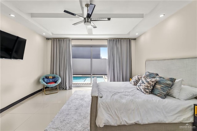 bedroom with access to exterior, light tile patterned floors, a tray ceiling, and recessed lighting