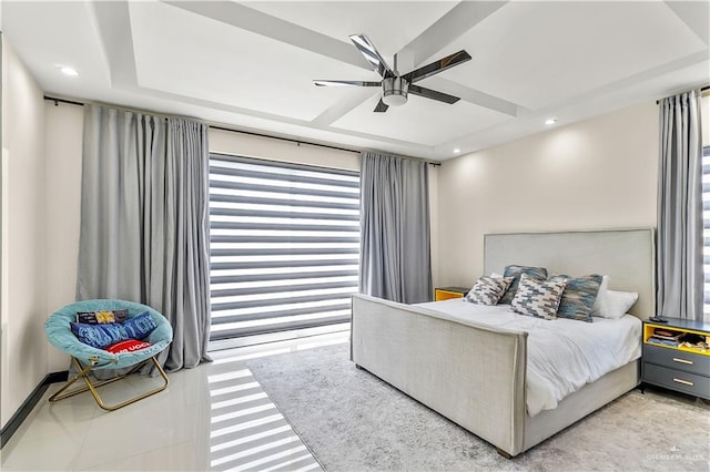 bedroom with ceiling fan, a tray ceiling, and recessed lighting