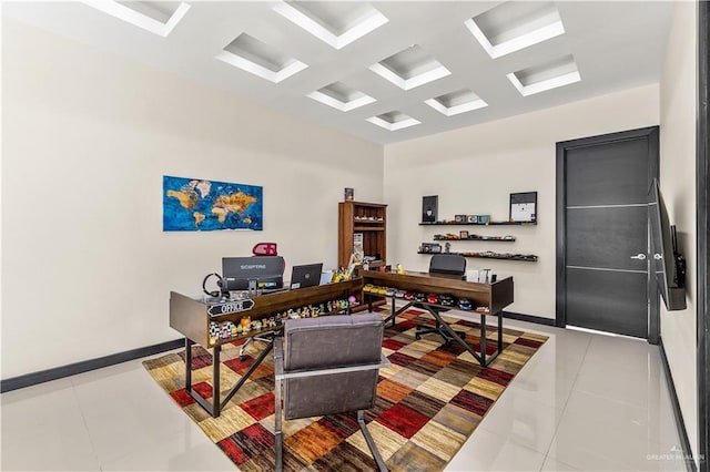 office with baseboards, coffered ceiling, and tile patterned floors