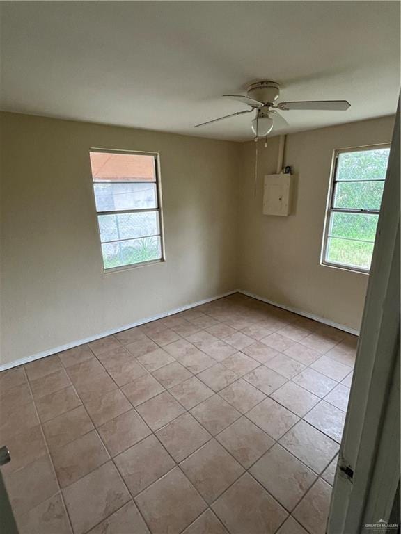 2322 E La Pointe Ave, Alton, TX 78573 - unfurnished room featuring light tile patterned flooring, ceiling fan, and baseboards