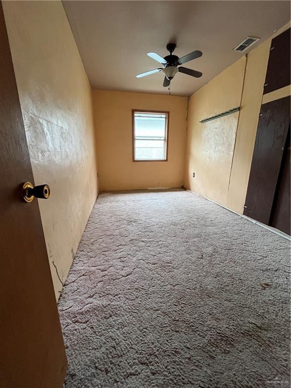 2322 E La Pointe Ave, Alton, TX 78573 - unfurnished bedroom with carpet flooring and a ceiling fan