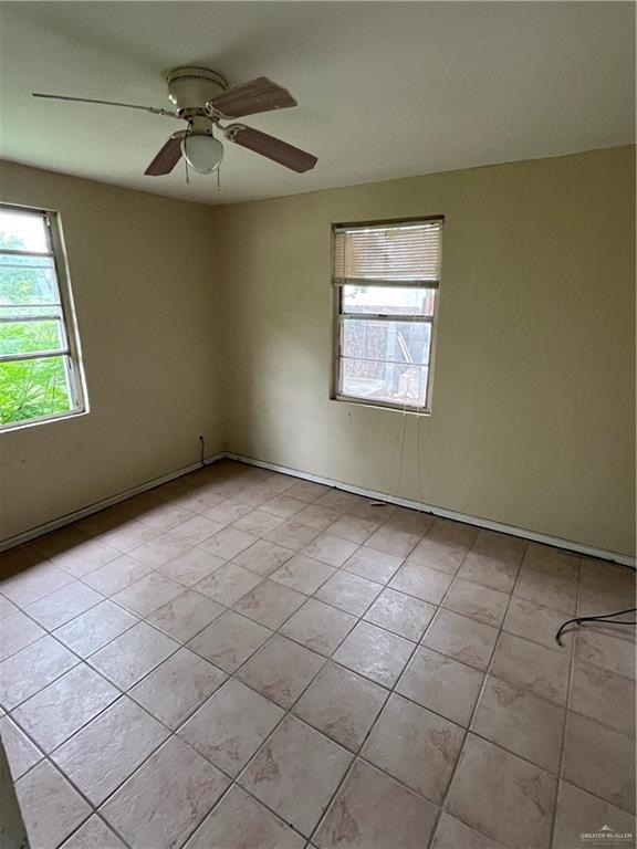 2322 E La Pointe Ave, Alton, TX 78573 - spare room featuring light tile patterned flooring and a ceiling fan