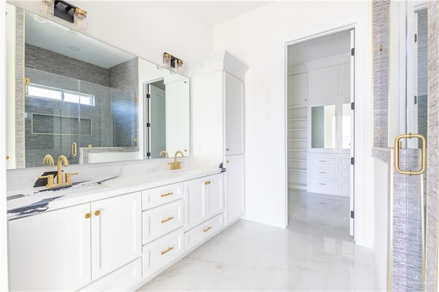 bathroom featuring tile patterned floors, vanity, and a shower with door