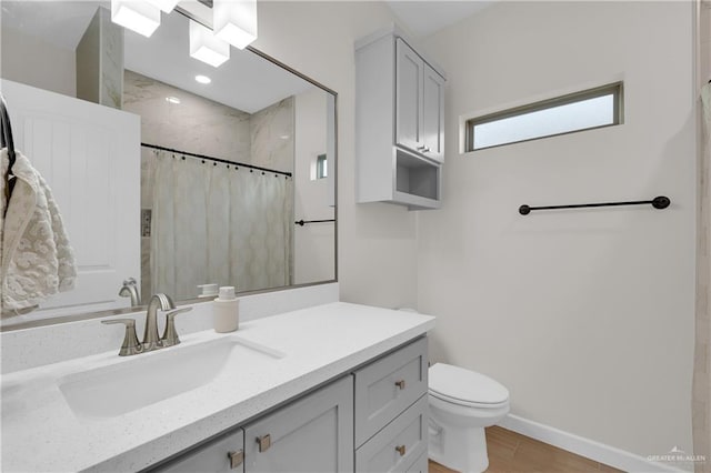 9219 N 25th St, Mcallen, TX 78504 - full bathroom with toilet, a shower with curtain, vanity, and baseboards