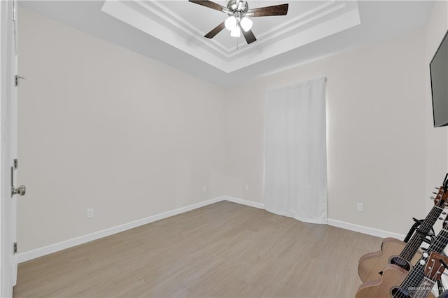 9219 N 25th St, Mcallen, TX 78504 - interior space with light wood-type flooring, a tray ceiling, baseboards, and a ceiling fan