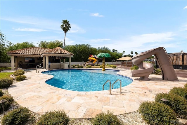 view of pool with a gazebo, a patio, and a water slide