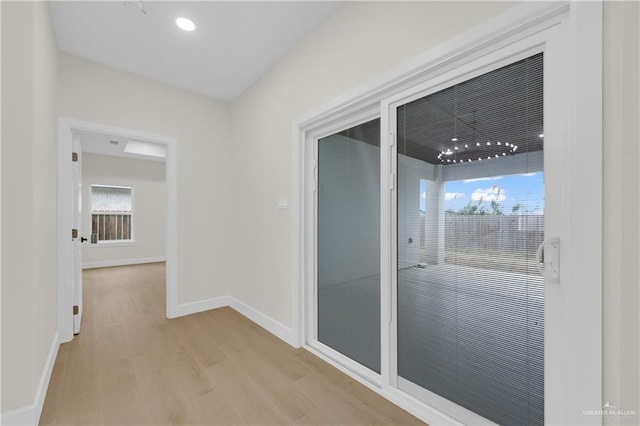 corridor featuring light hardwood / wood-style flooring