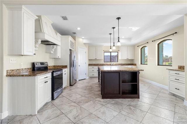 2601 Moreno Sr, Edinburg, TX 78541 - kitchen featuring stainless steel appliances, custom range hood, a sink, open shelves, and baseboards