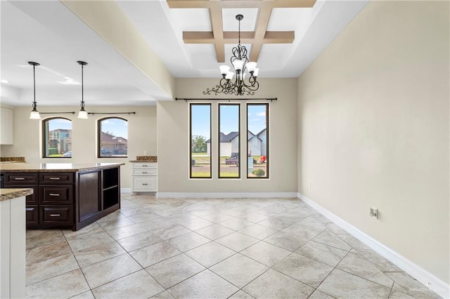 2601 Moreno Sr, Edinburg, TX 78541 - kitchen featuring coffered ceiling, light stone countertops, beamed ceiling, a chandelier, and hanging light fixtures
