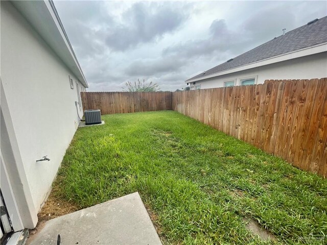 view of yard featuring central AC unit